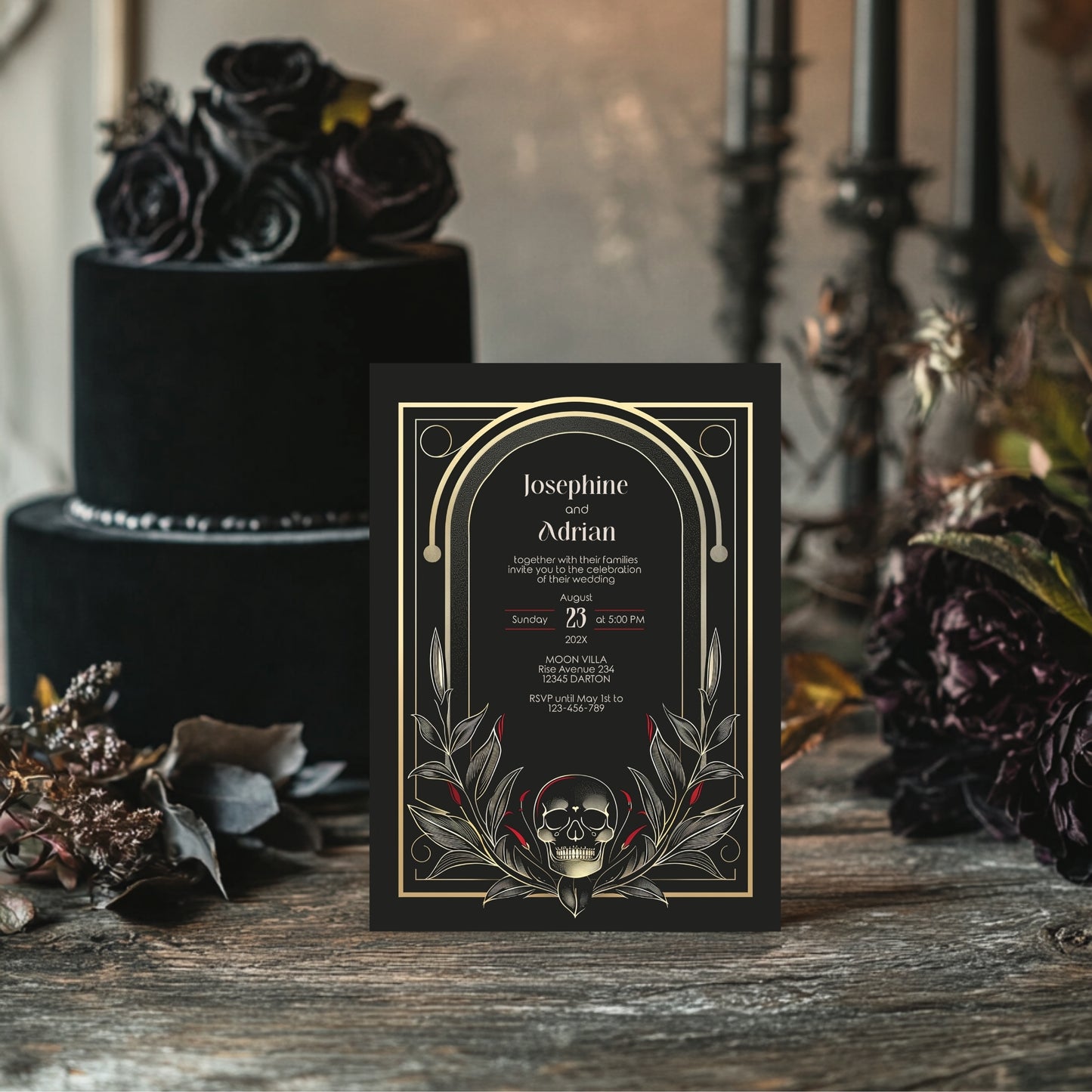 Gothic-style wedding invitation with skull design on a wooden surface with flowers.