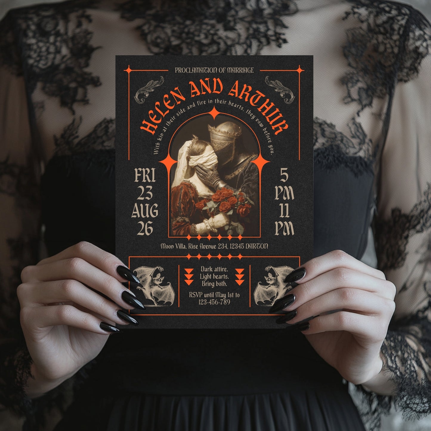 Person holding a gothic-style wedding invitation with intricate brutalism graphic designs and text.